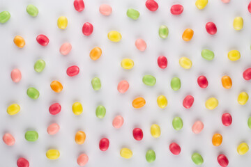 Small round candy-colored pastels on pastel background.