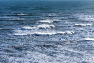 Naklejka premium Beautiful winter view of picturesque Atlantic Ocean in Iceland. A waves of the Atlantic Ocean hit the coast of Iceland. The coast of Atlantic Ocean in winter.