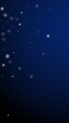 Sparse snowfall Christmas background. Subtle flying snow flakes and stars on dark blue background. Adorable winter silver snowflake overlay template. Lively vertical illustration.