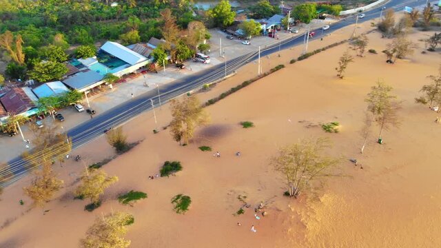 Aerial view of Red Sand Dunes (local name is Doi Cat Do), also known as Golden Sand Dunes, is located near Hon Rom beach, Mui Ne, Phan Thiet city
