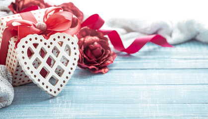 Festive composition for Valentine's Day with gift box and decorative heart copy space.