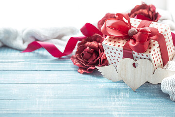 Festive composition for Valentine's Day with gift box and decorative elements copy space.