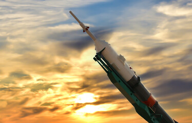 Space rocket at sunset before launch into space. NASA uses rockets and spacecraft to send humans into space and to study places in the solar system where humans cannot travel.