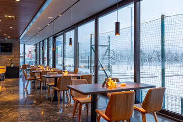 Interior of an empty mountain restaurant with marble floor