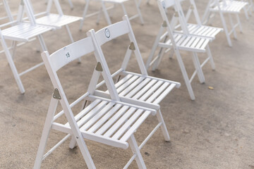 Rows of empty metal chair seats installed for some business event or performance,festival