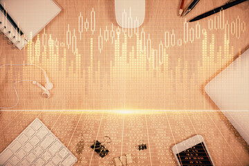 Multi exposure of forex graph hologram over desktop with phone. Top view. Mobile trade platform...