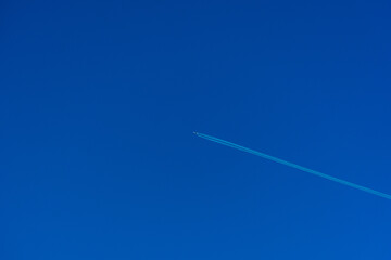 aesthetic airplane in a blue sky background, minimalistic