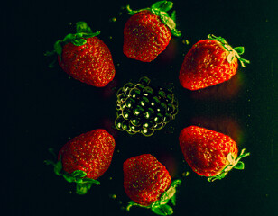 strawberries in water, strawberries and black background 