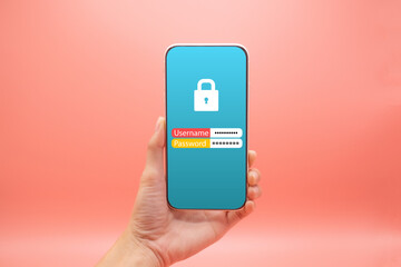 Hand woman holding mobile smartphone with username and password icon isolated on pink background, close-up hand touching phone isolated on pink,mock-up smartphone blank screen easy adjustment .