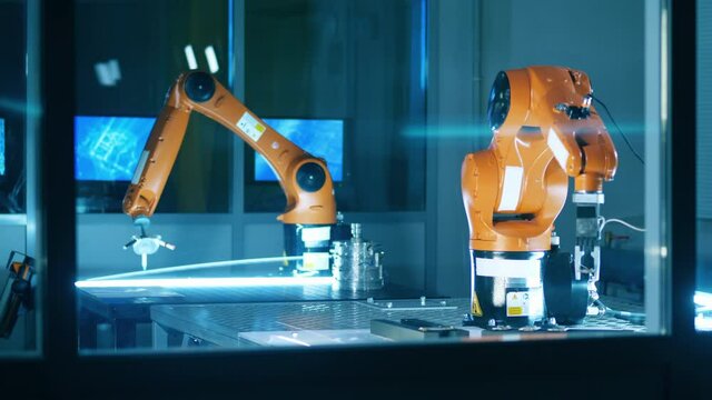 Science lab with two functioning robotic mechanisms