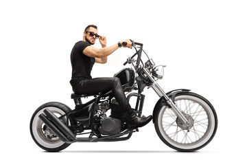 Plakat Fit young man riding a chopper motorbike