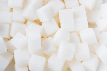 Sugar cube texture background sweet food ingredient, studio shot health high blood risk of diabetes, and calorie intake concept