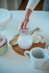 Young beautiful woman bakes a cake. Sweets. Confectionery.