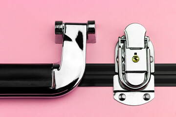 pink suitcase close-up handle and locks, professional makeup artist's cosmetic bag