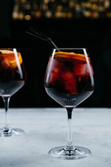 Bloody alcohol cocktails front view on stone plate