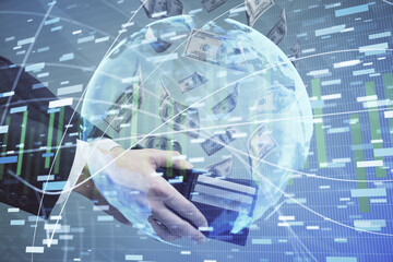 Multi exposure of financial theme drawing hologram and USA dollars bills and man hands. Business concept.