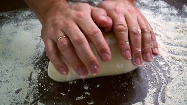 Italian Pizza Dough, chef hands kneads the dough DIY homemade dought concept. chef hands kneads the dough