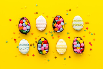 Easter chocolate eggs and sweets, top view