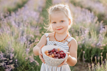 Girl Hold Bowl with Tasty Raspberry and Gooseberry