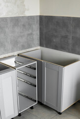 Lower custom kitchen cabinets installation with a furniture facades mdf. Gray modular kitchen from...