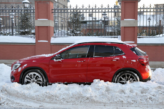 MOSCOW, RUSSIA - JANUARY 17, 2021: Mercedes-Benz car in a snowdrift near the roadside of the dorga under a layer of snow. Winter.