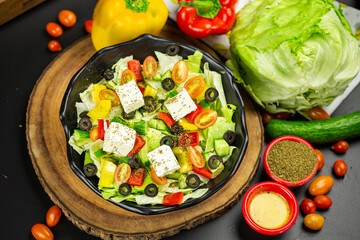 Greek salad top view dark theme