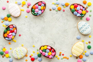 Happy Easter with chocolate eggs and sweets, top view