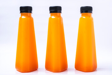 Fresh orange juice in clear plastic bottle