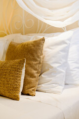 Beautiful luxury pillow on decoration in bedroom interior Light brown and beige colors