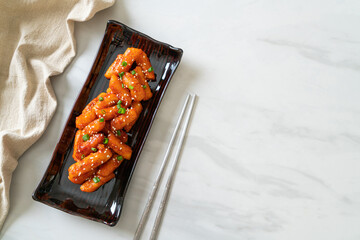 deep fried Korean rice cake (Tteokbokki) skewered with spicy sauce