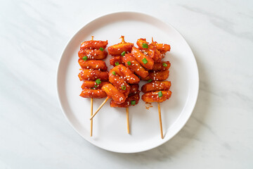 deep fried Korean rice cake (Tteokbokki) skewered with spicy sauce