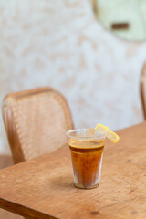Specialty coffee menu called 'Dirty coffee' . Cold milk in the bottom with hot espresso shot on top