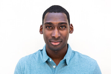 Obraz premium Close up handsome young black man against isolated white background