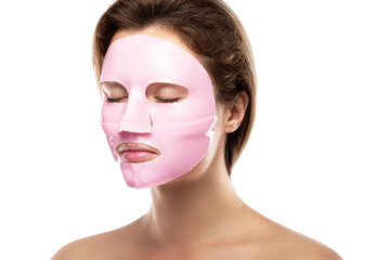 Young beautiful woman with rubber facial mask on her face