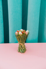 Bouquet of roses flowers. Pink and green curtain background. Minimal trendy style and aesthetic.