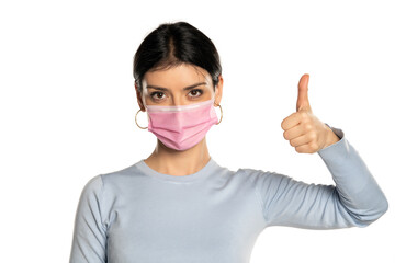 Woman with mask showing ok sign, isolated on white background.