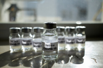 canisters with covid-19 vaccines