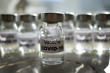 canisters with covid-19 vaccines