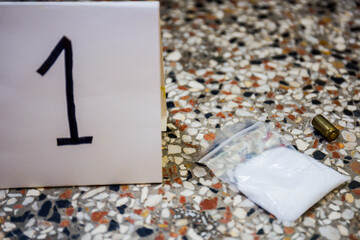 The crime scene, murder, investigation, police find rejected the gun used by the murderer, taken as evidence of the murder, an expert with rubber gloves and takes go in the bag as evidence