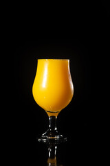 Orange juice, beautiful glass of orange juice with black background, selective focus.
