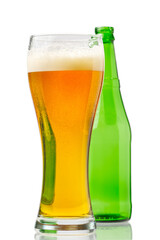 glass with beer and green bottle isolated on white