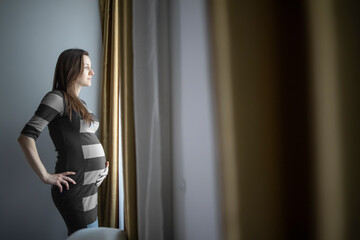 Fototapeta na wymiar Worried single pregnant woman worrying about her future