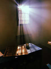 prison life. prison leisure. the sun's rays from the prison bars. backgammon game in prison