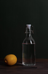 Glass bottle with water and lemon. Detox. Zero waste