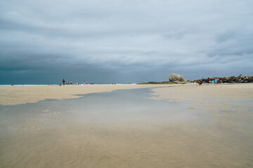 Wide shot with Currumbin beach rock in the background