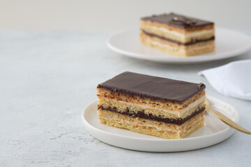 Opera cake is a type of almond sponge cake with a coffee and chocolate filling.