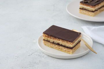 Opera cake is a type of almond sponge cake with a coffee and chocolate filling.