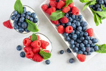 Curd dessert with berries and mint.