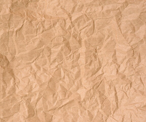 Obraz premium crumpled blank sheet of brown wrapping kraft paper