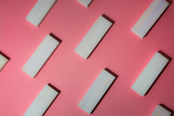  pink background with a pattern of blocks. View from above